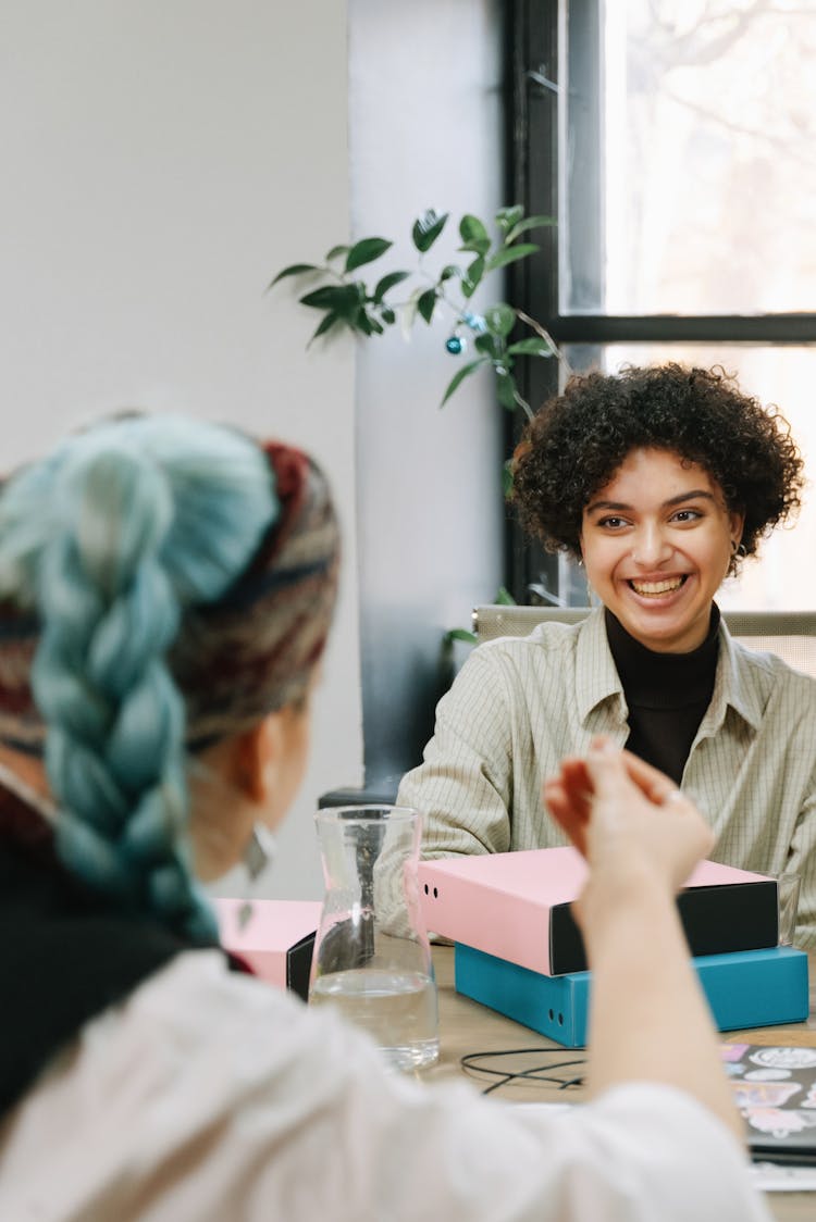 A Group Of People Having A Meeting In The Office