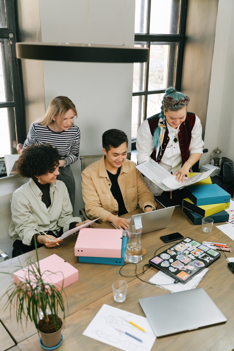 A Group Of People Having A Meeting In The Office