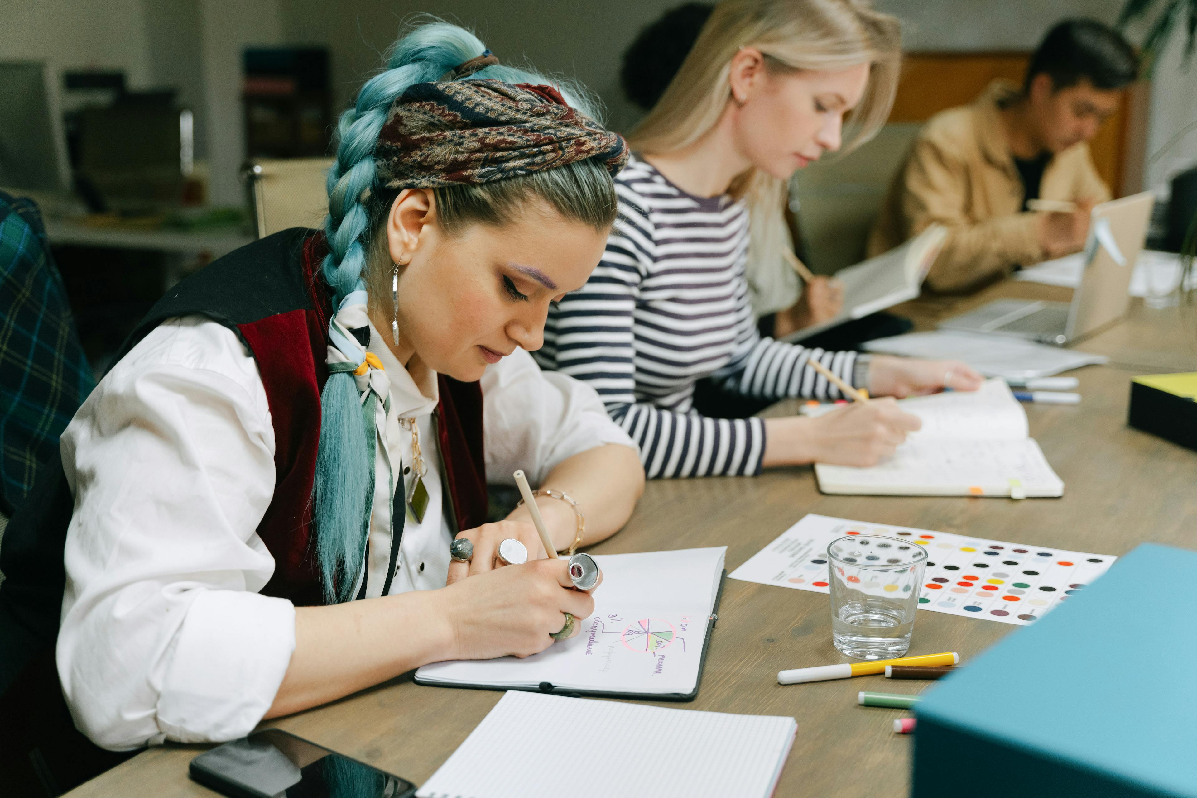 A creative team collaborating on a visual design project in a bright office space
