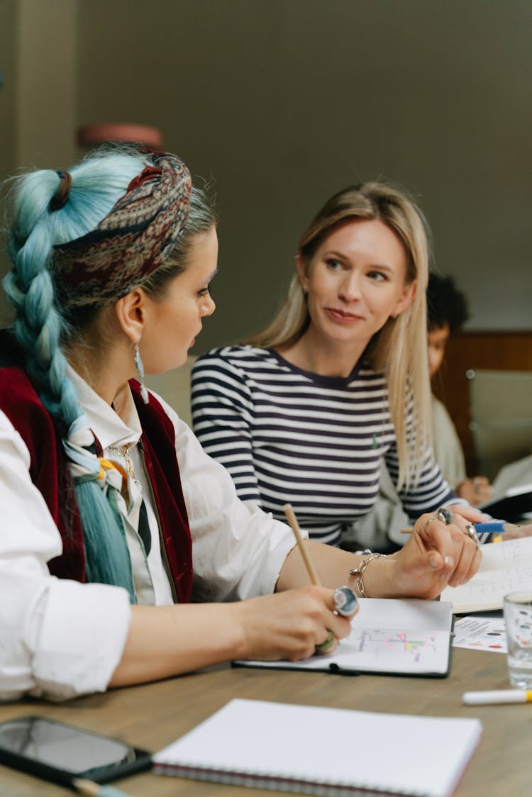 A Group Of People Having A Meeting In The Office