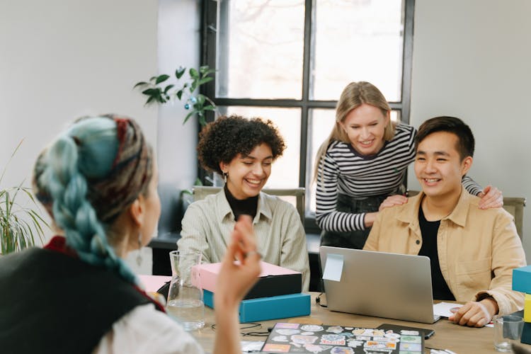 A Group Of People Having A Meeting In The Office