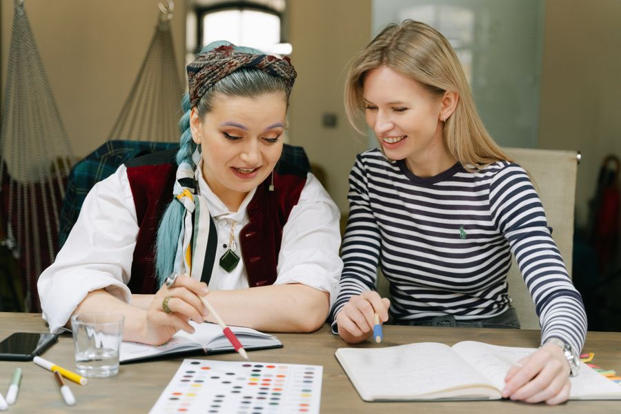 Two women working together