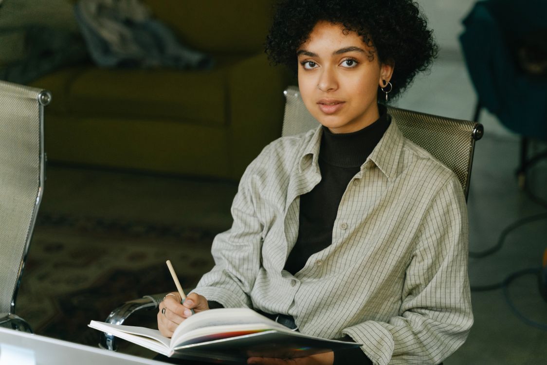 Write In The Notebook A Woman Writing in the Notebook · Free Stock Photo