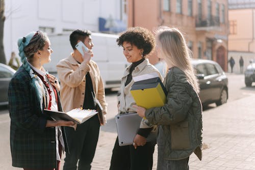 Group of Employees Standing on a Sidewalk