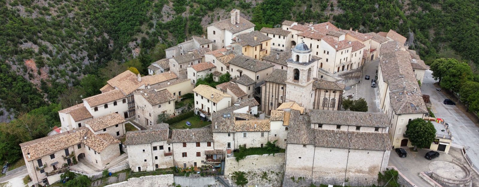 Stunning aerial view of the medieval village Castello di Postignano in Sellano, Italy.