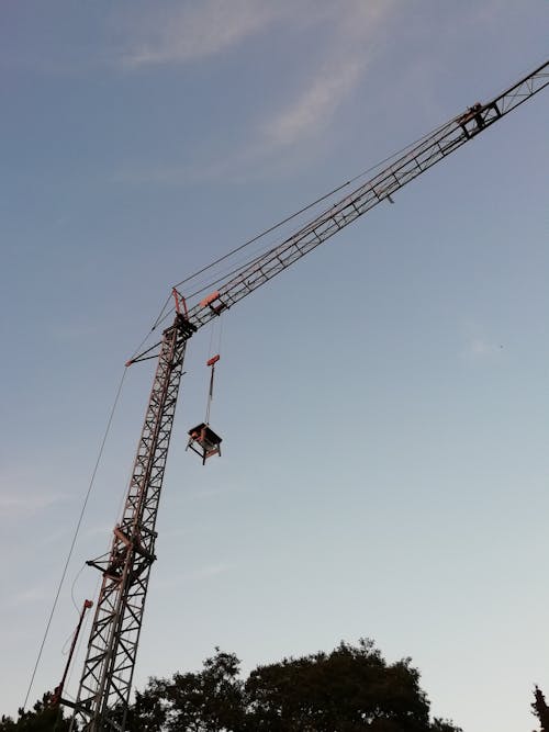 Free Construction Crane Lifting up Piece of Equi Stock Photo