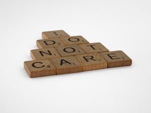 Brown Wooden Scrabble Tiles on White Background