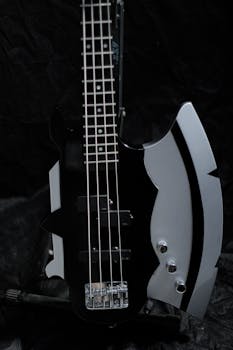 Close-up of a unique axe-shaped electric guitar with shiny details.