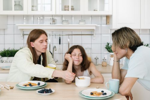 Free Casual family breakfast in a bright kitchen setting, fostering togetherness. Stock Photo
