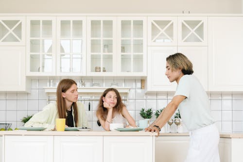 Free Men Having Breakfast with Their Daughter Stock Photo