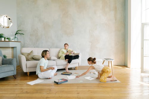 Free A Family Sitting at the Living Room Stock Photo