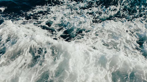 Sea Foam on Blue Ocean