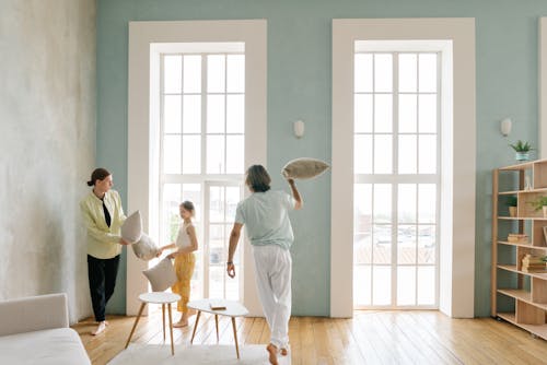 A Family Playing Pillow Fight at Home