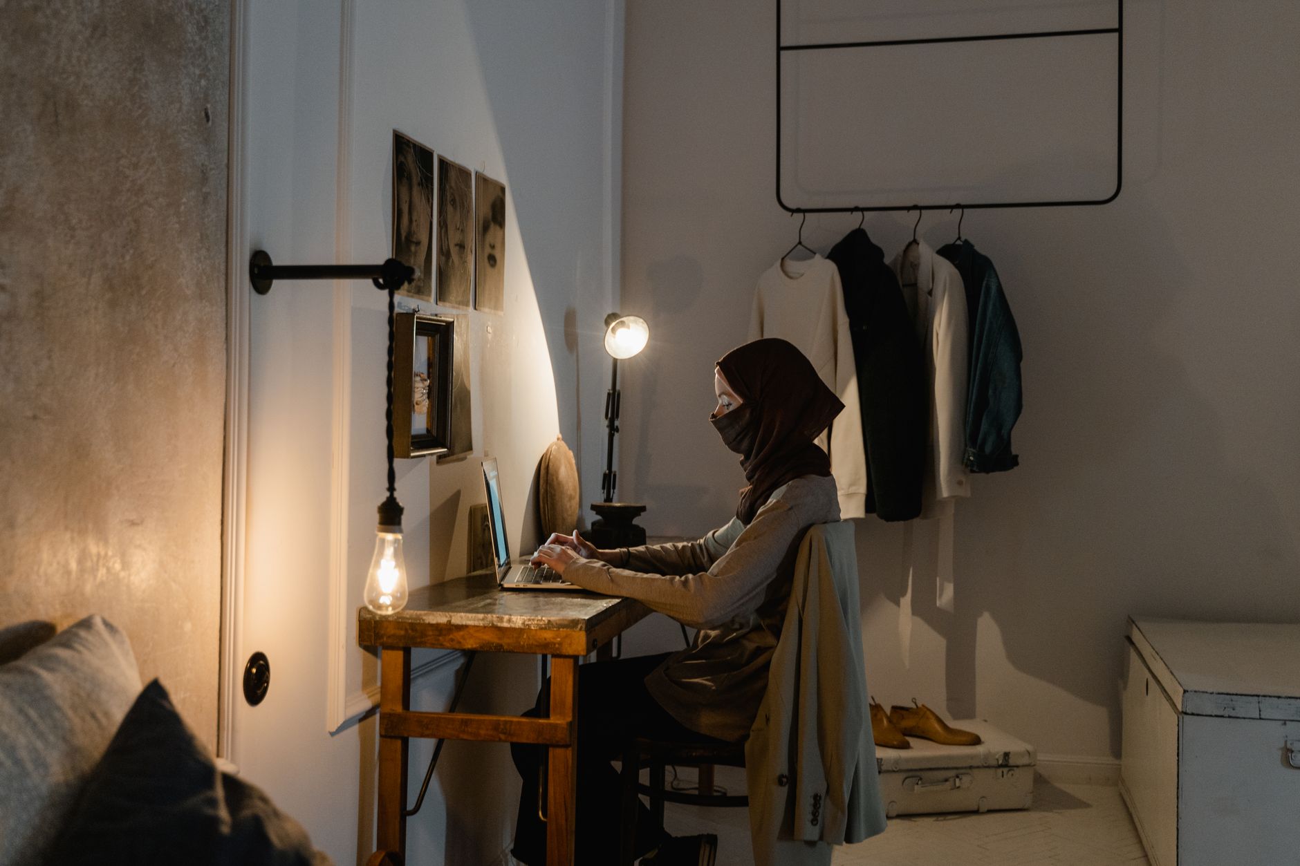 A laptop showing lines of code on a desk at night, the shape of a side project nobody planned to start
