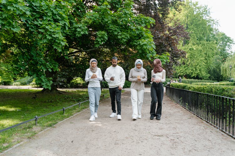 Group Of Friends Walking In The Park