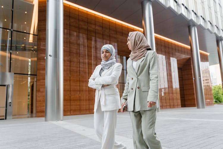 Women Walking Together Outside A Building