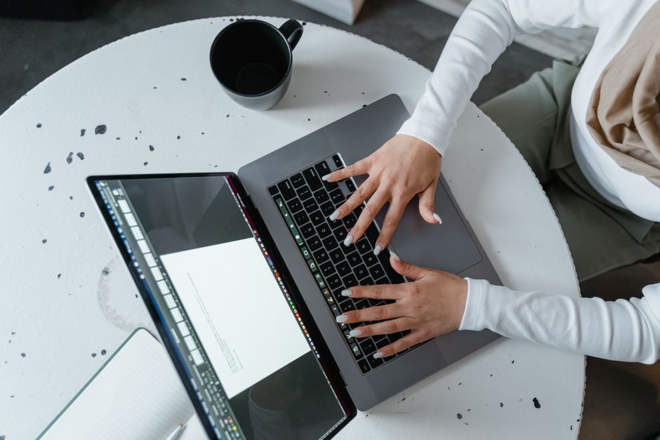 How QuickBooks Self Employed Simplifies Deductible Expense Tracking for Freelancers Overhead view of a woman