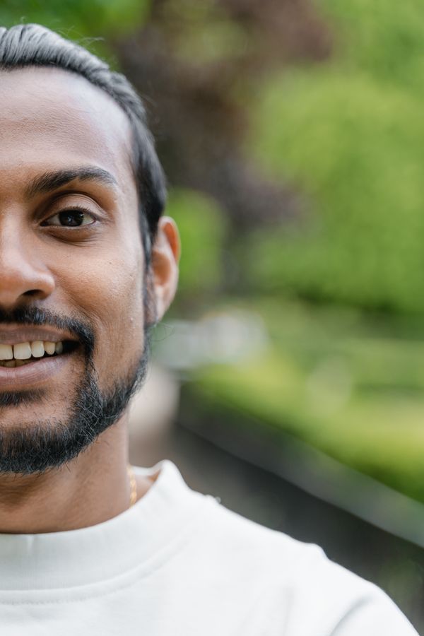 A Solvane engineer smiling outdoors — photo by MART PRODUCTION on Pexels