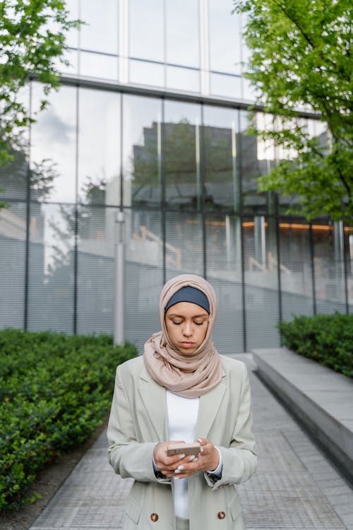 Free Woman in White Hijab Standing on Gray Concrete Pavement Stock Photo