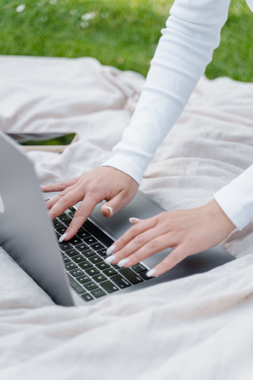 Woman Typing on a Laptop Computer