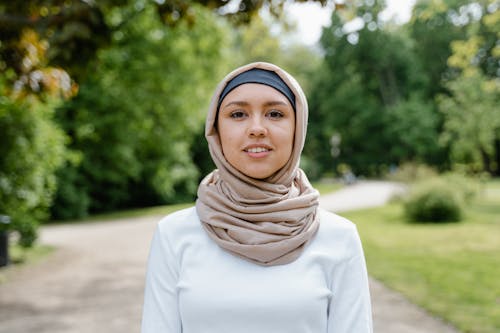 Portrait of a Beautiful Woman Wearing Beige Hijab