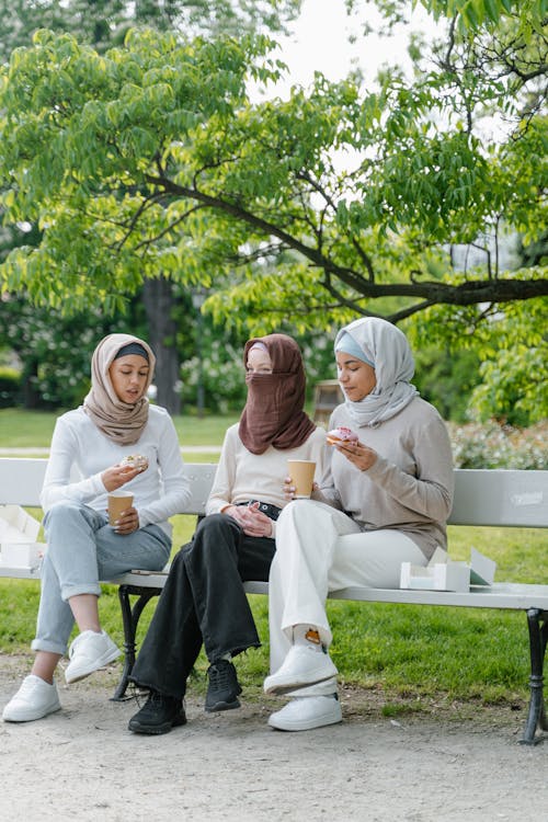 Women Sitting on the Bench in the Park