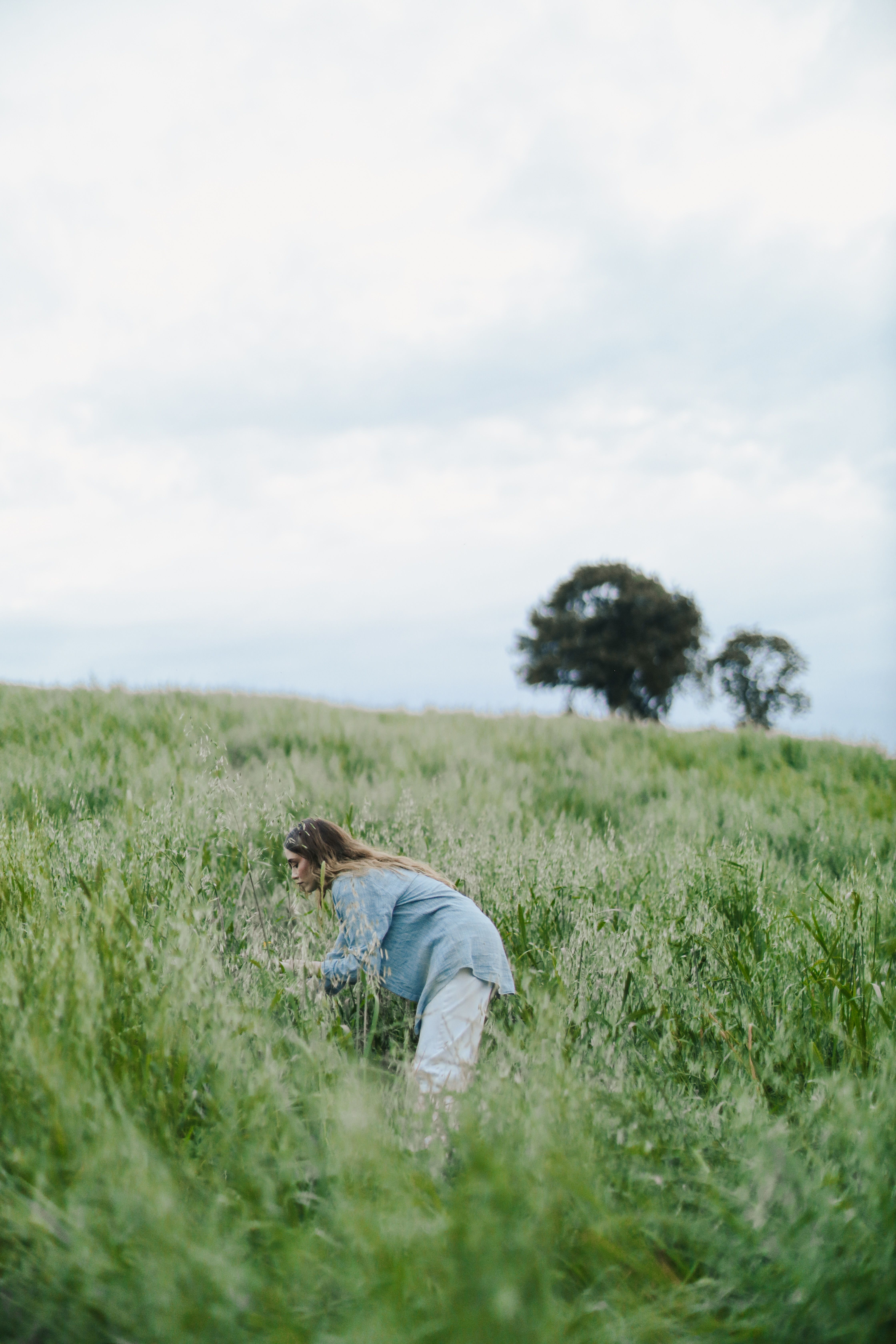 A Woman Standing on the Grass · Free Stock Photo