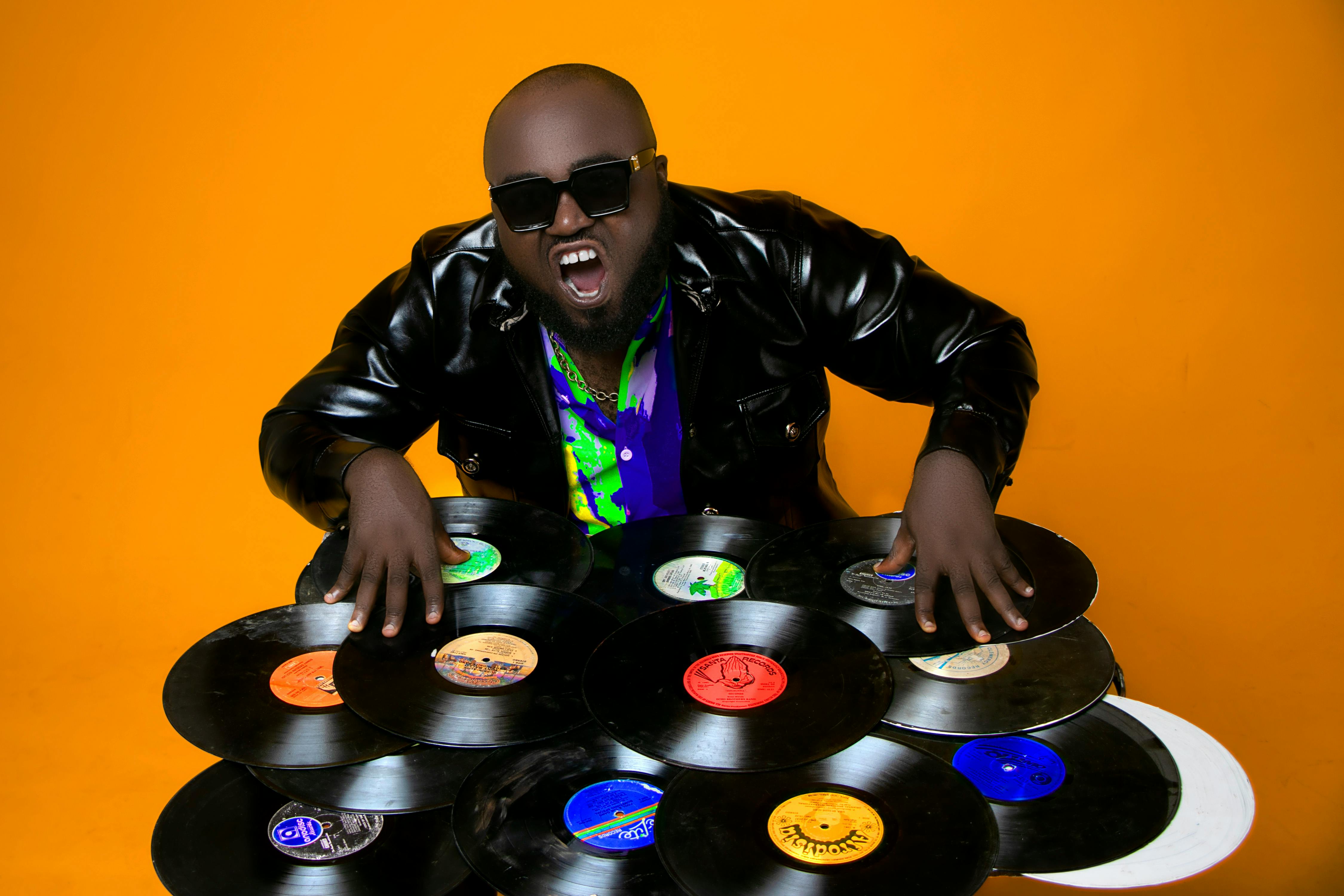 cheerful black man with vinyl records