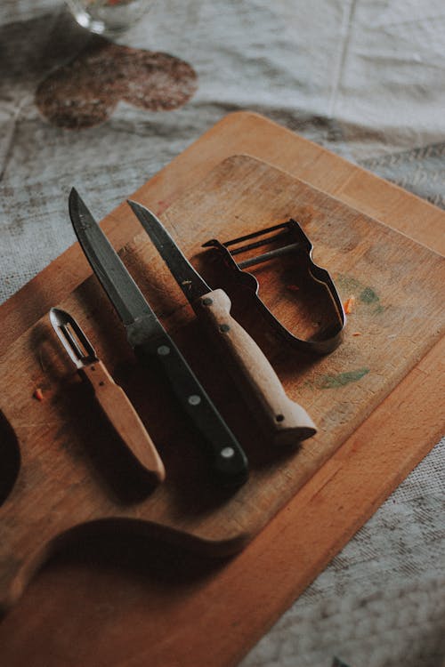 Knives on a Wooden Chopping Board