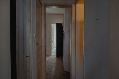 Dim apartment corridor, photo by Faruk Tokluoglu on Pexels