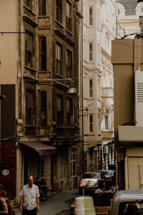 Free Rustic charm of a narrow city street with vintage architecture and bustling life. Stock Photo