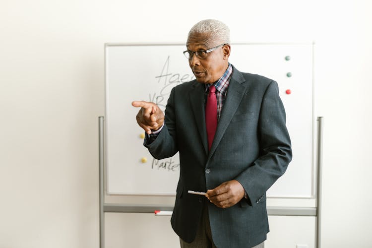 Man Presenting In A Meeting