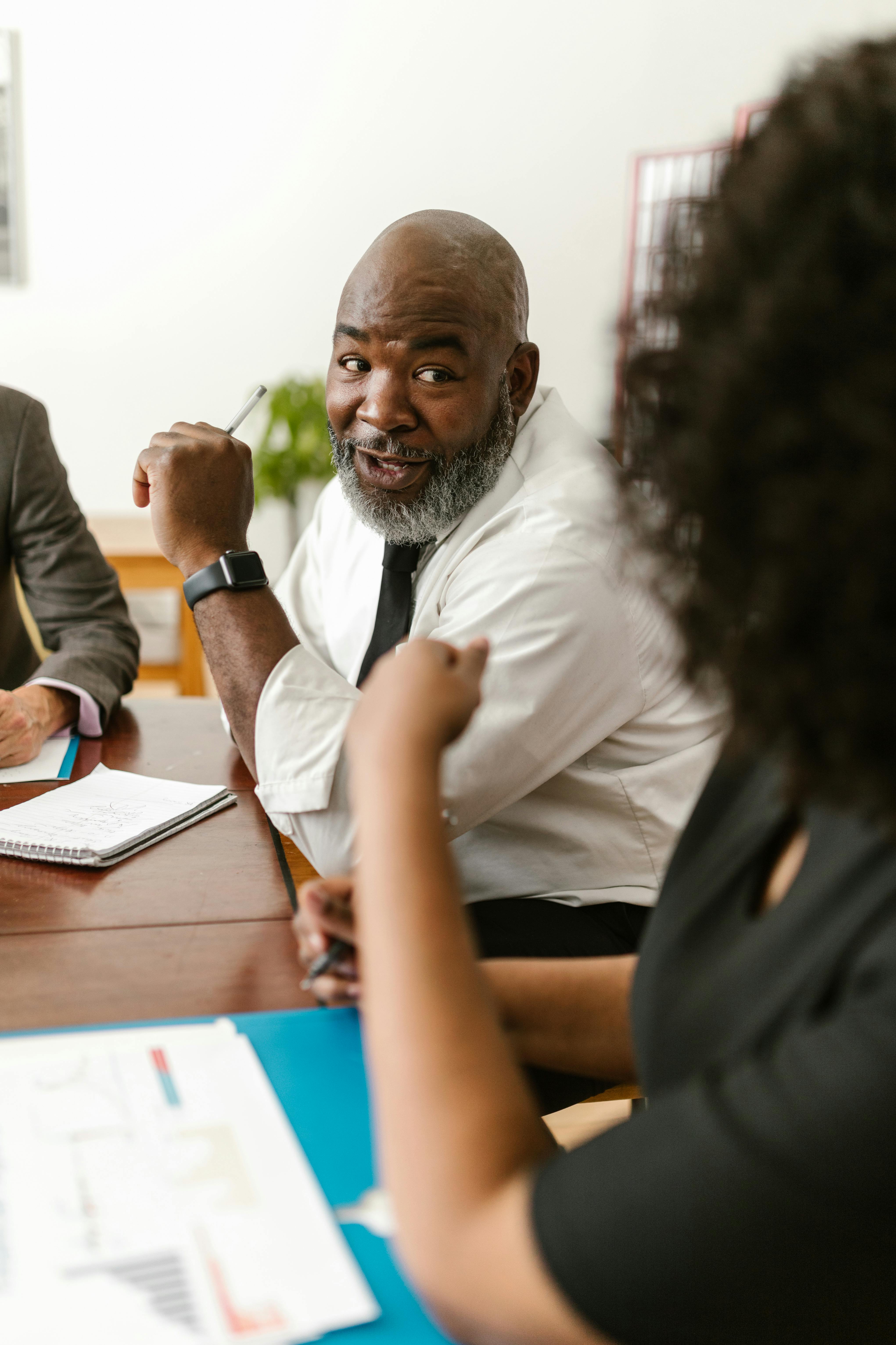 Business colleagues discussing strategy in a modern office meeting