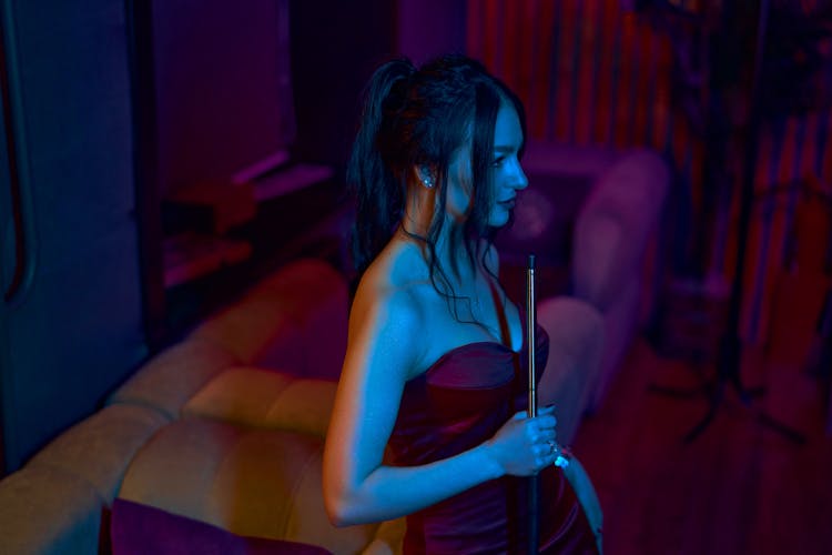 Black Haired Woman With Hookah Hose In Hand