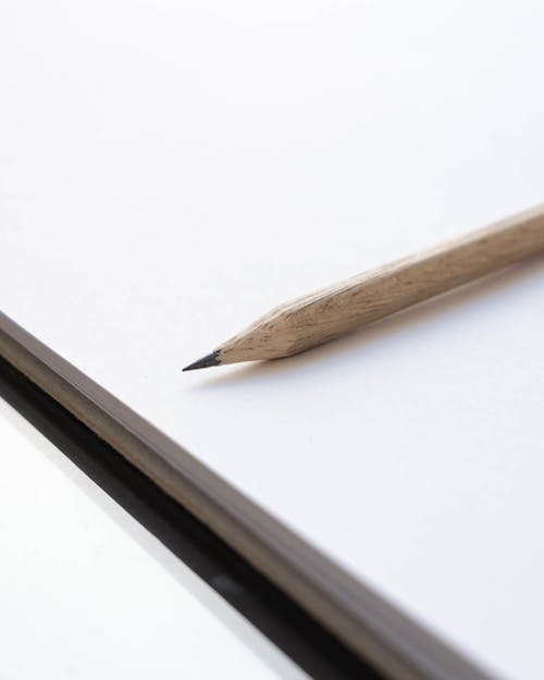 Wooden Pencil on White Surface