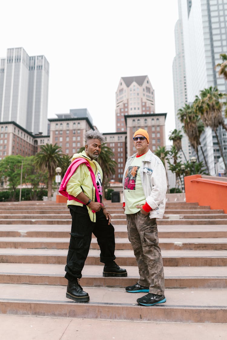 Elderly Men Standing On Concrete Stairs