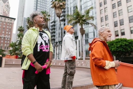 Three elderly men in vibrant outfits exploring a modern cityscape together.