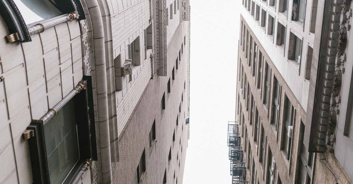 Low Angle Shot of High Rise Buildings with Glass Windows · Free Stock Photo