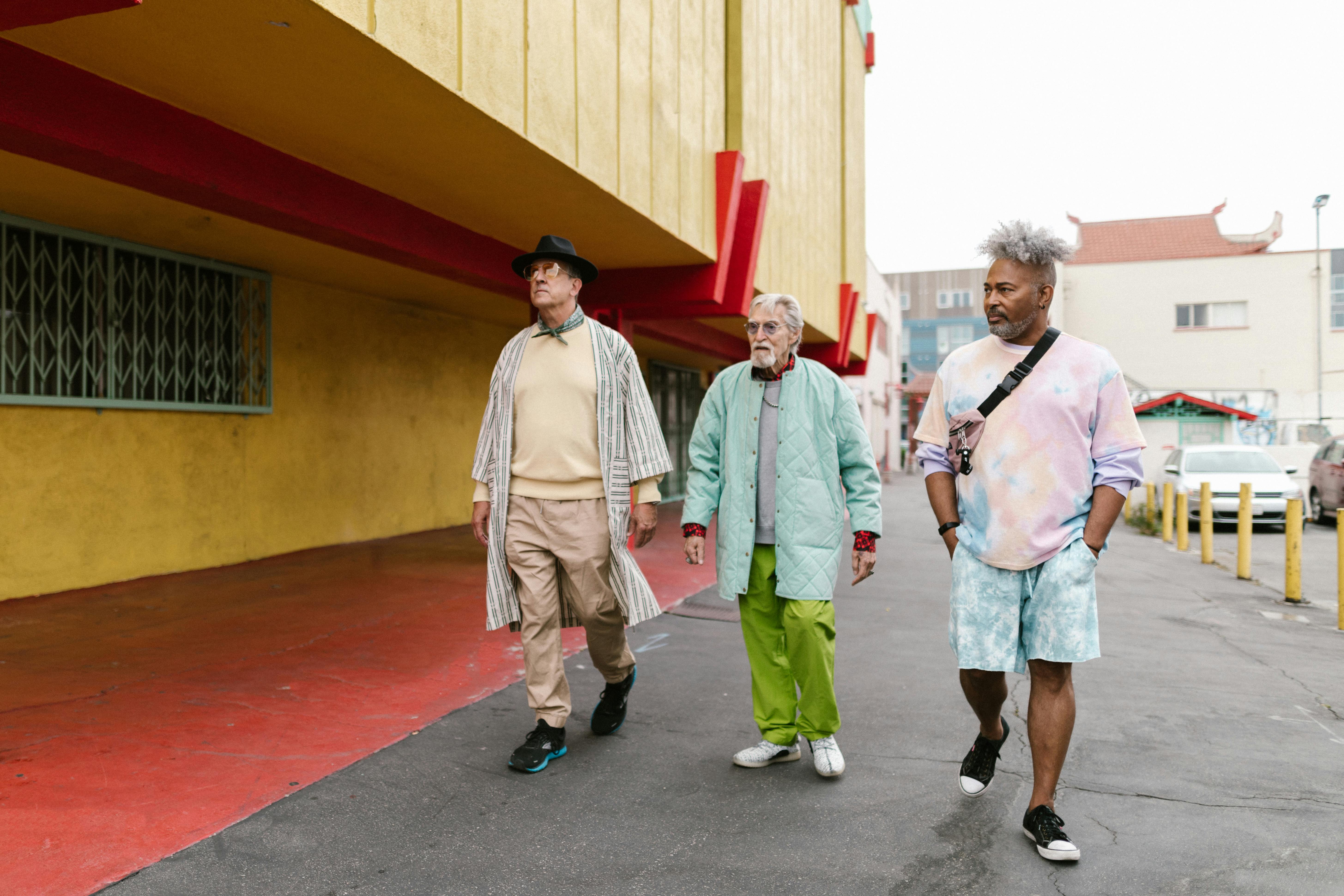 stylish men walking together in the street