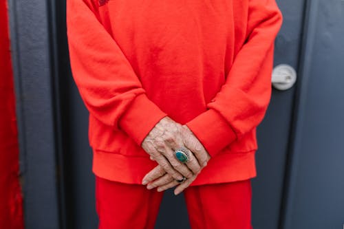 Person in Red Long Sleeve Shirt and Pants