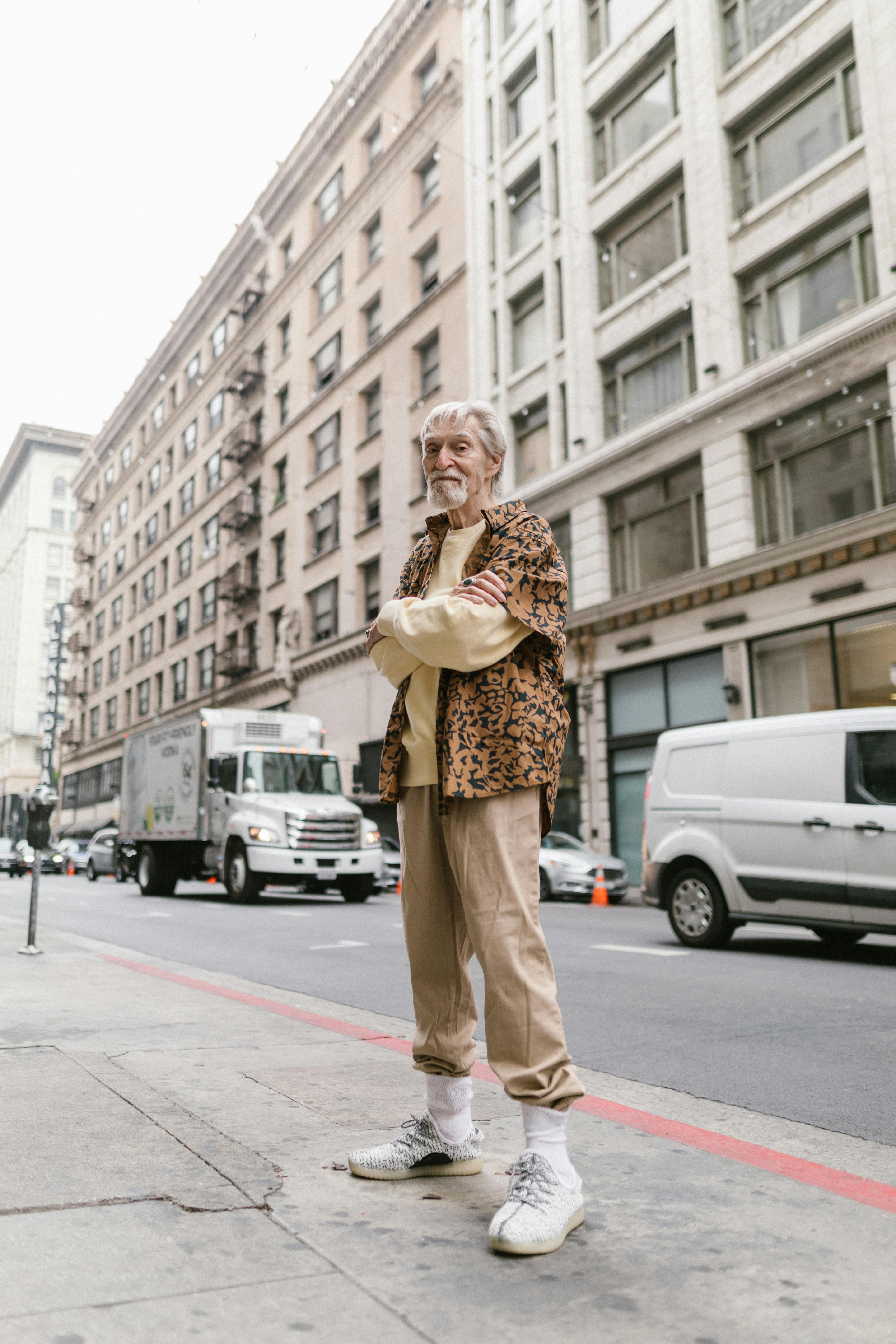 elderly man standing on the street