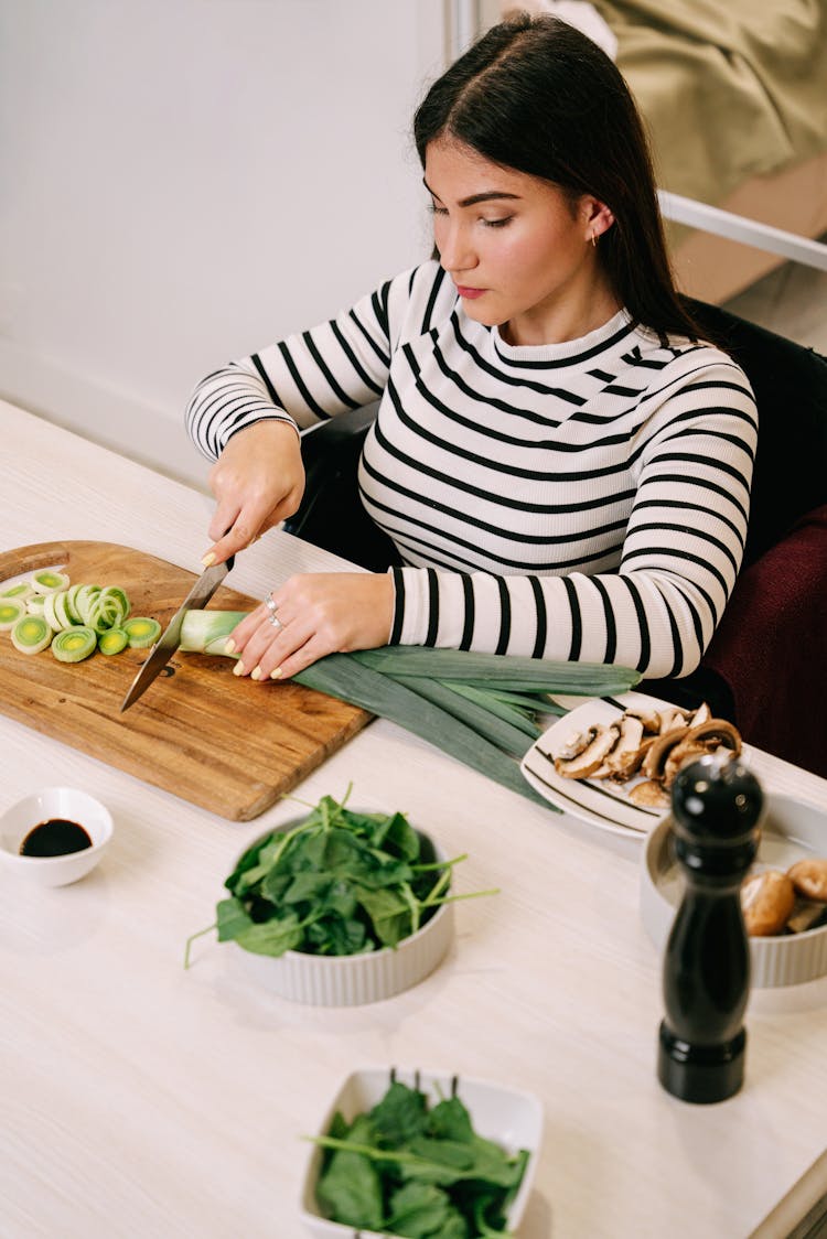 Woman Cutting Onion Leeks