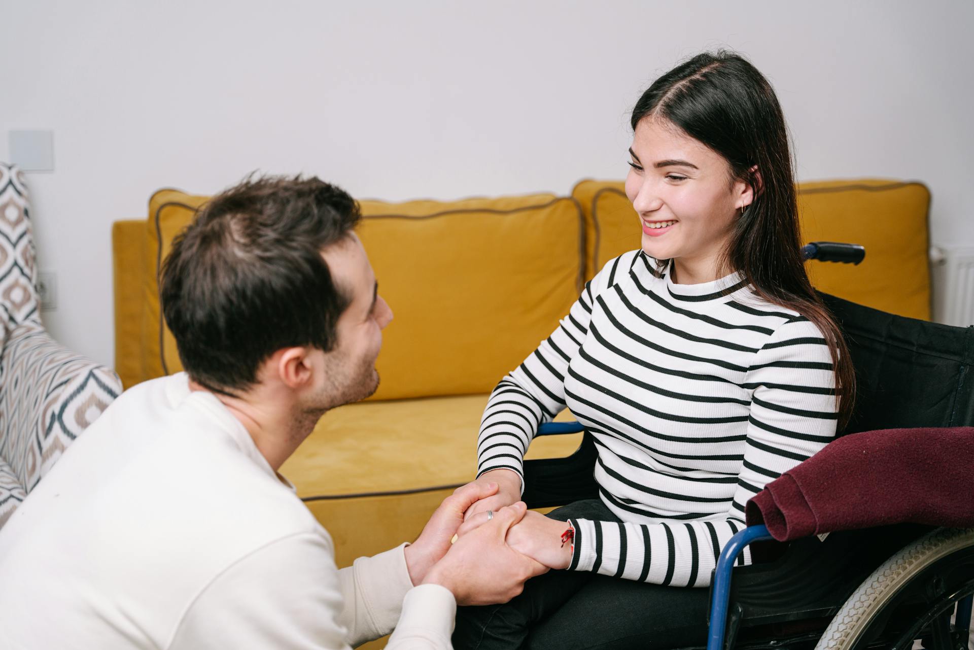 Happy couple sharing a warm moment of care and comfort indoors.
