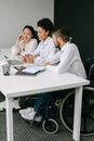 Man in White Dress Shirt Sitting Beside Woman in White Dress Shirt