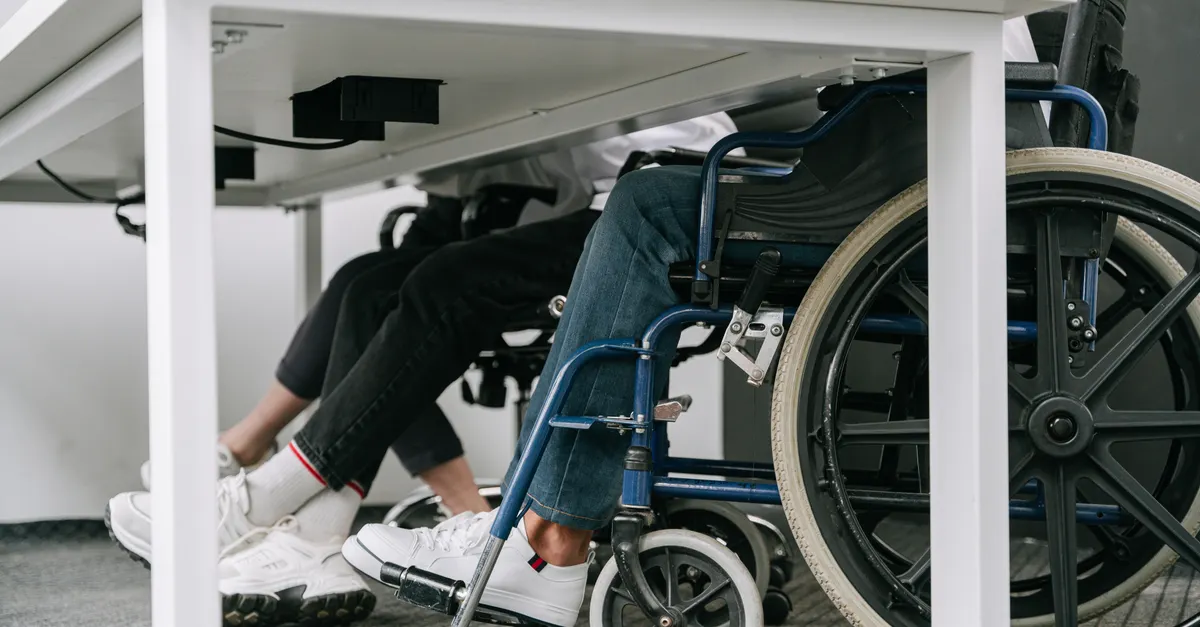 A person using crutches outside an Indian courthouse, representing motor accident disability compensation claims before the MACT