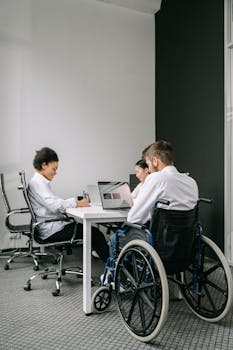 A diverse team working together around a table in a modern office setting.