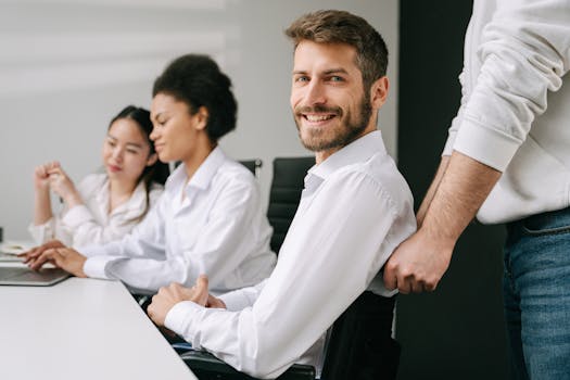 A diverse team working together in an inclusive office setting, highlighting collaboration and accessibility.