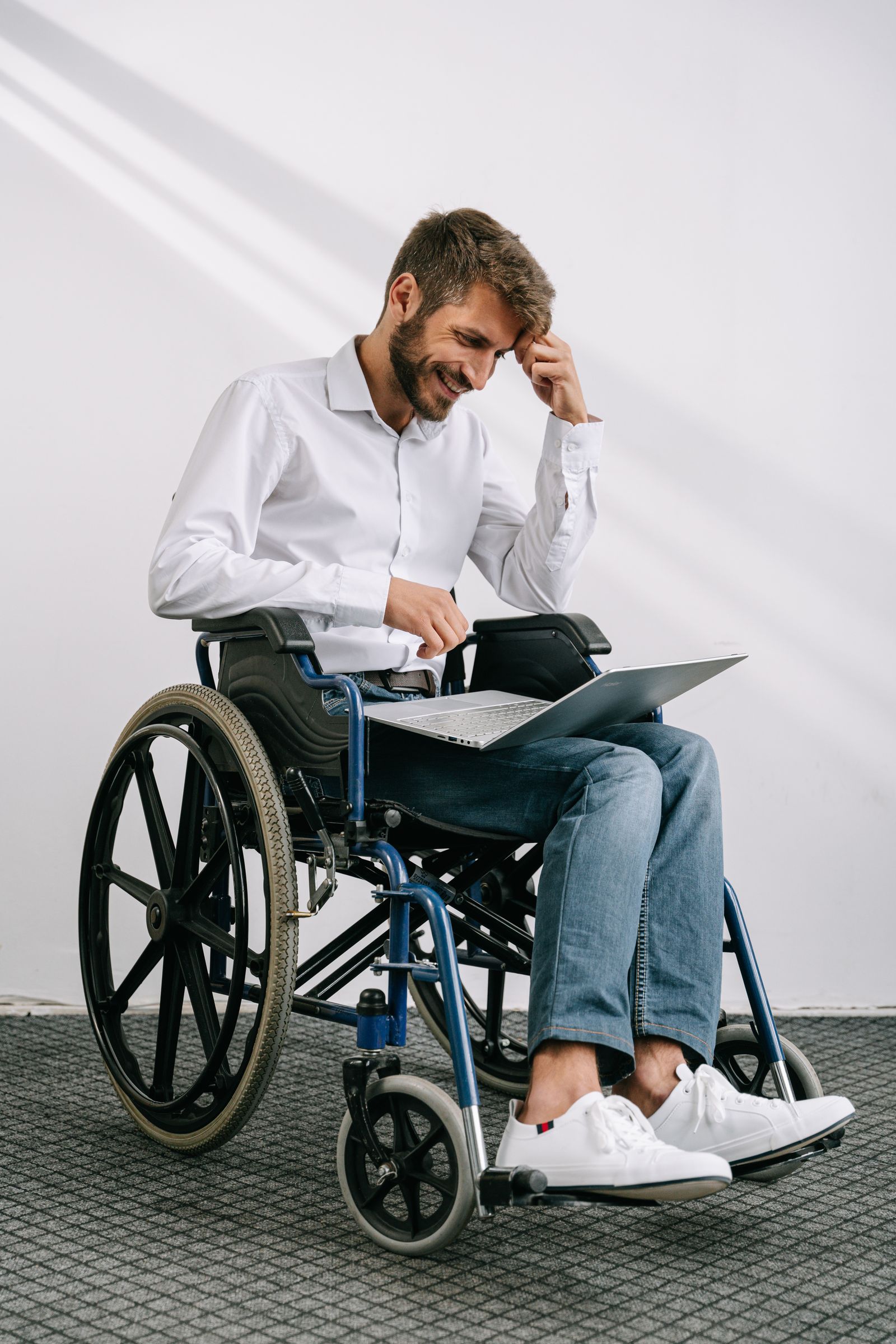 Professional wheelchair user working with accessible technology