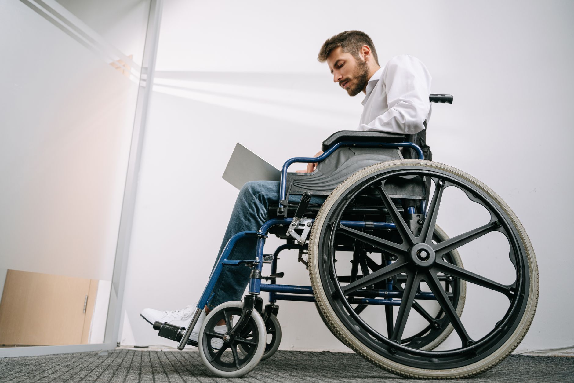 a disability benefits worksheet showing 2026 income thresholds beside a calculator and monthly wage statements