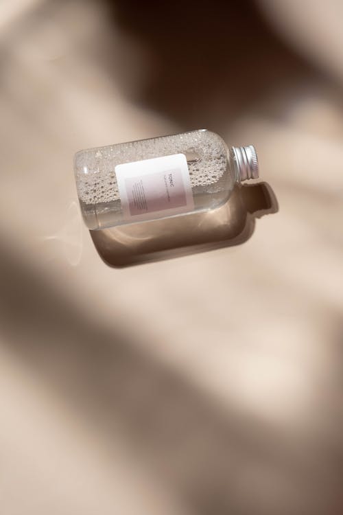 Free Clear Glass Bottle With White Label Stock Photo